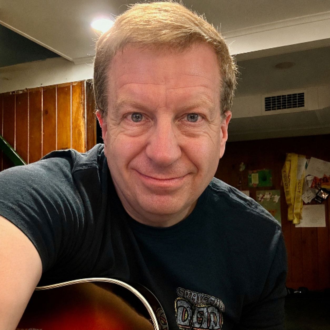 Neal Coxworth with his guitar